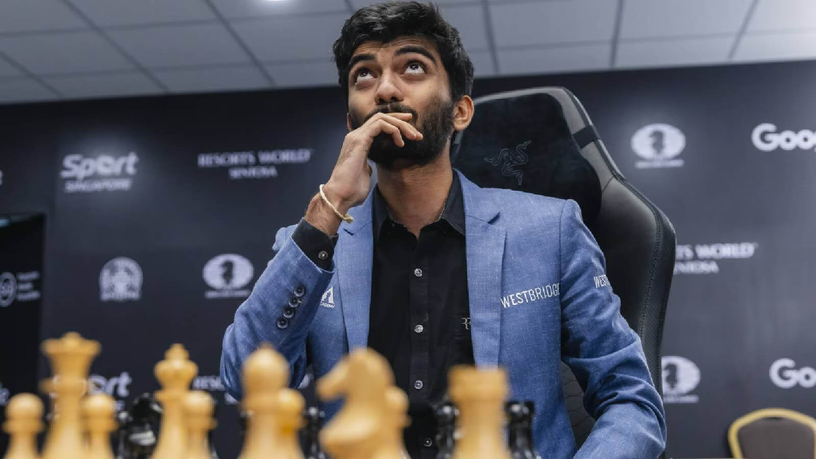 Young chess prodigy seated at a chessboard with trophies and a global map in the background, symbolizing international success.